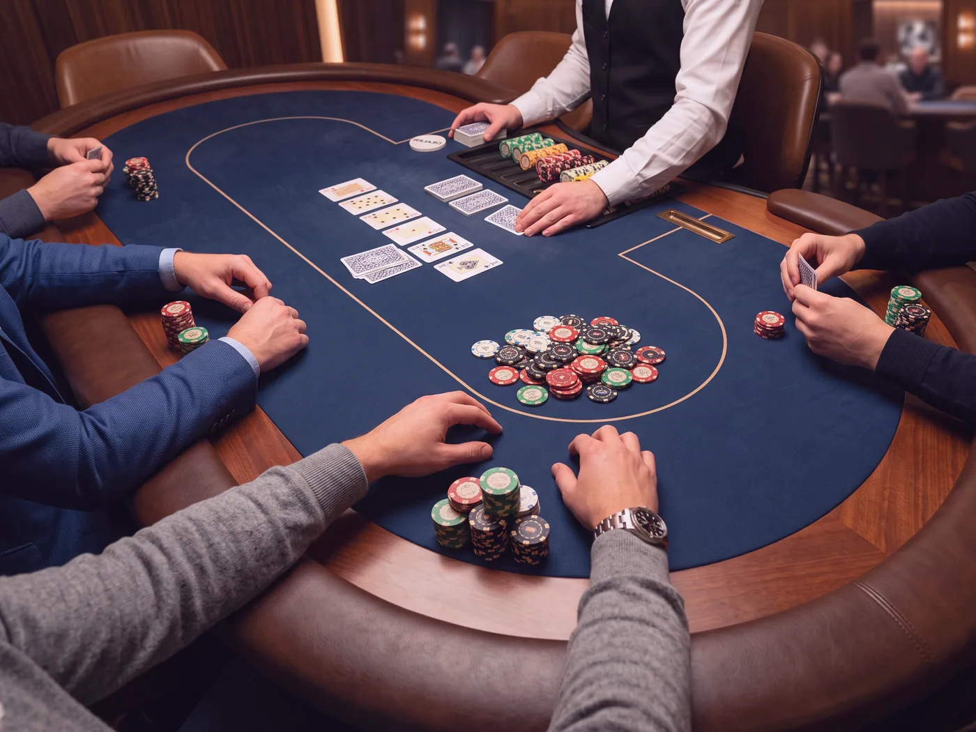 A card table set for euchre with chips stacked in front of each empty seat